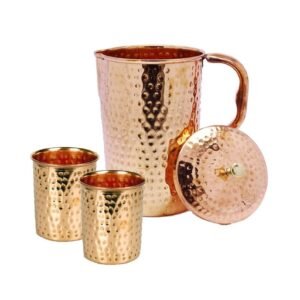 Hammered copper pitcher and glass set